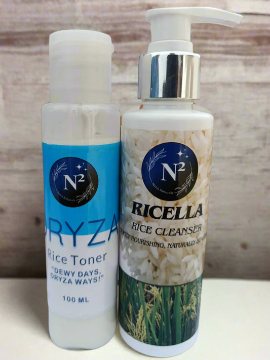 Two skincare products, Ryzar Rice Toner and Ricella Rice Cleanser, on a white surface with brown soap bars in the background.